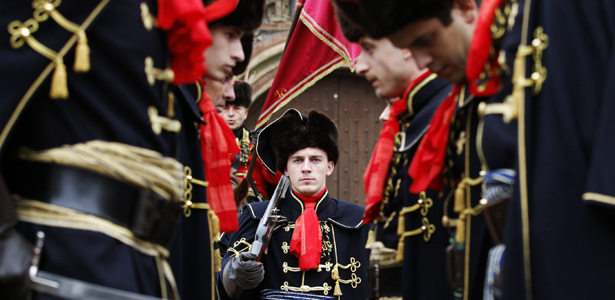 Soldiers in traditional military uniforms attend a guard exchanging ceremony at St. Mark's Square in Zagreb